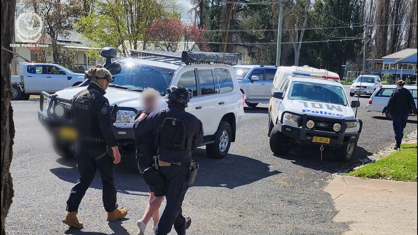 Two men charged after shots fired at home