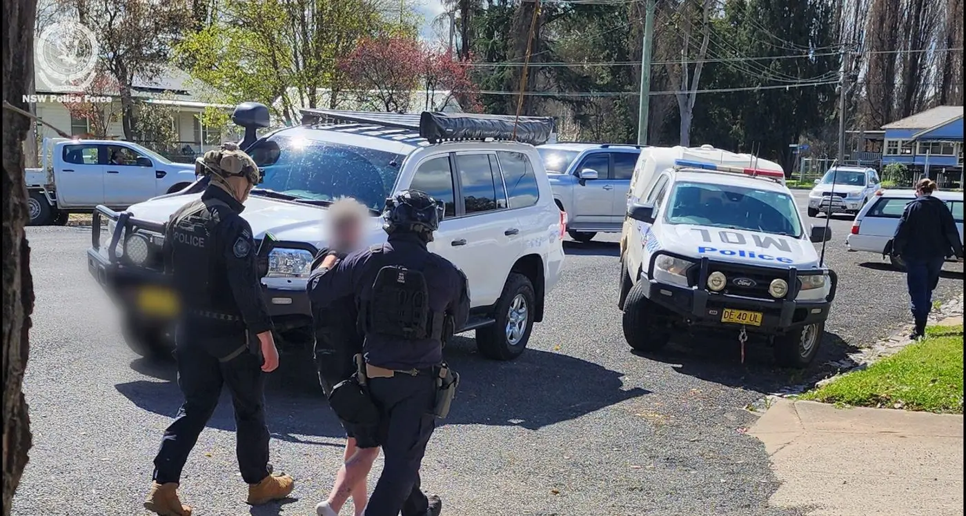 Two men charged after shots fired at home