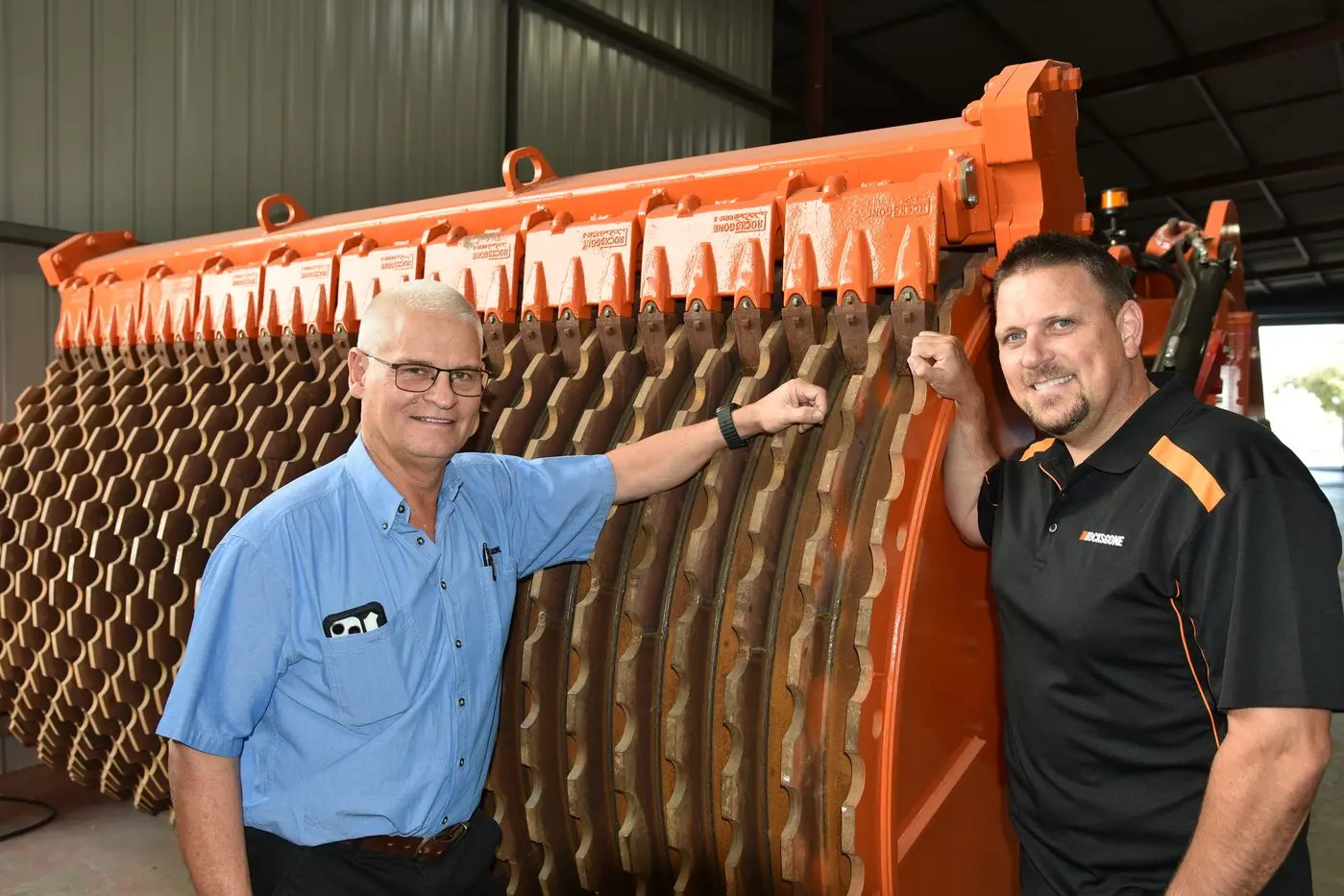 Rocks Gone founder and former farmer Tim Pannell and national business development manager Adrian Carr with the latest H4 Reefinator rock crushing machine that will be demonstrated near Parkes next week.