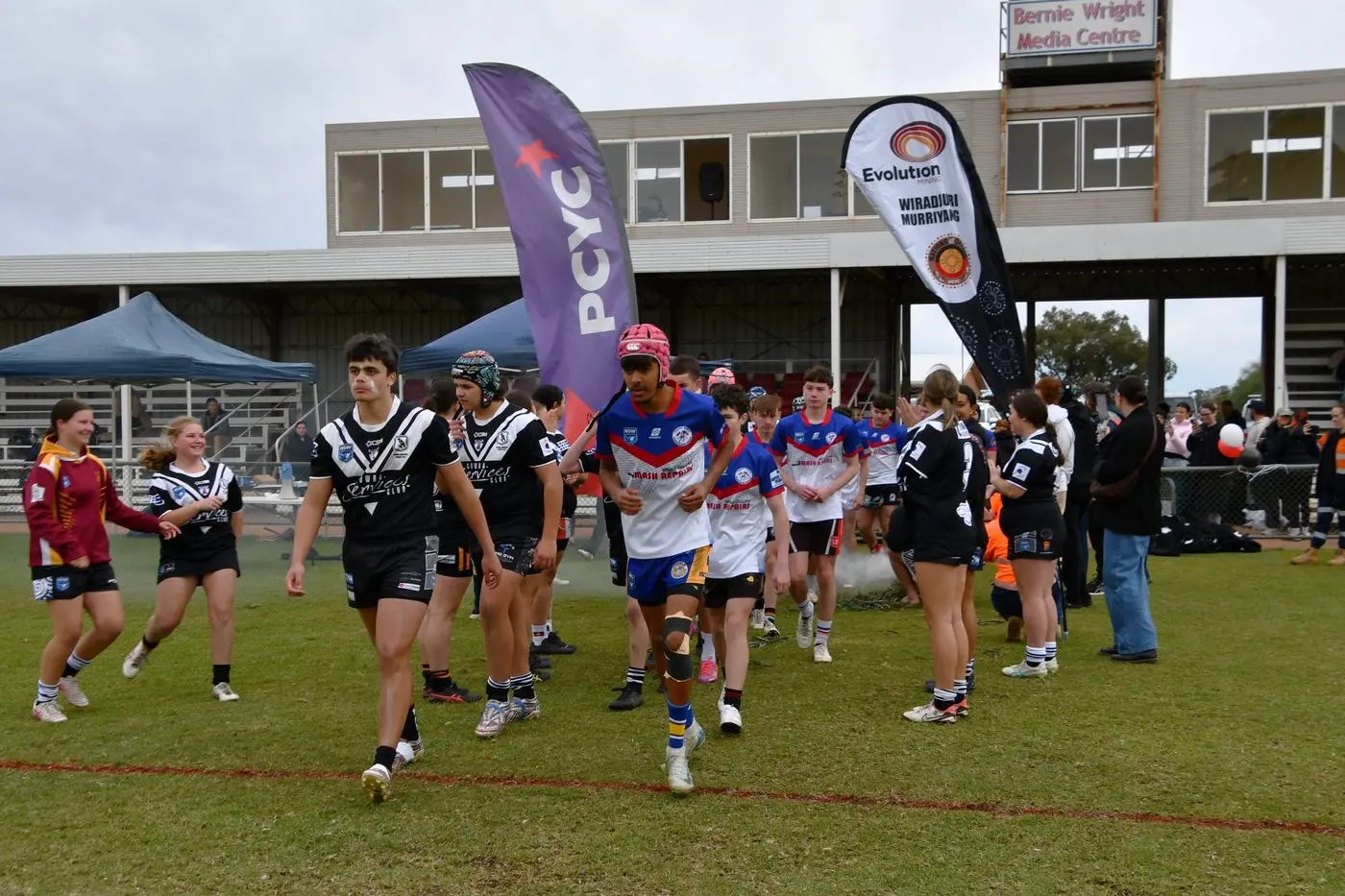 Parkes and Cowra boys run onto the field. PHOTOS: Jenny Kingham\\n