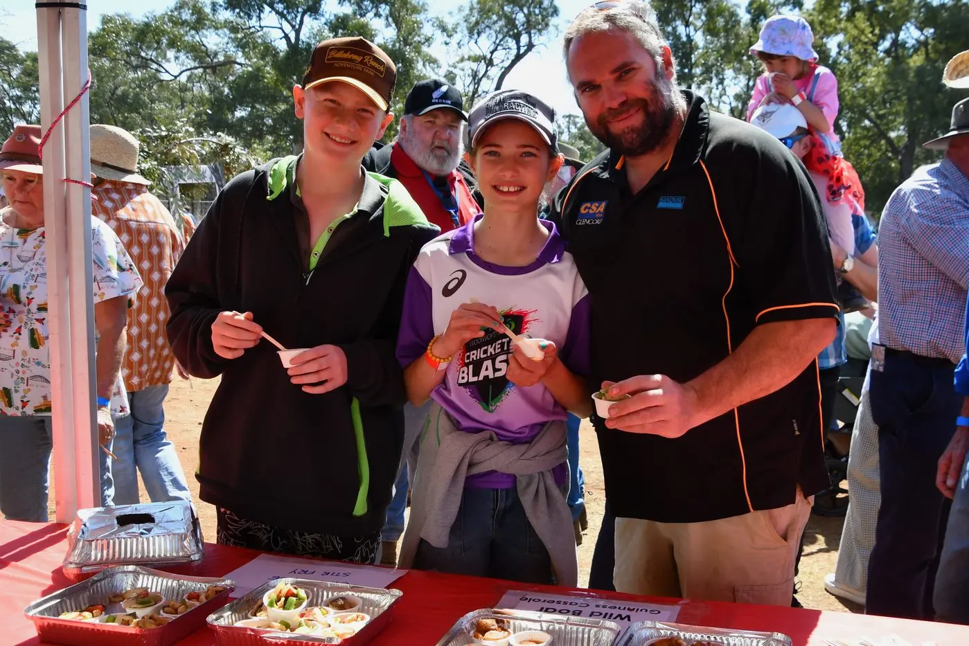 Xavier, Alexis and Davidi Gaut of Trundle tasting the crocodile kebabs. PHOTOS: Jenny Kingham