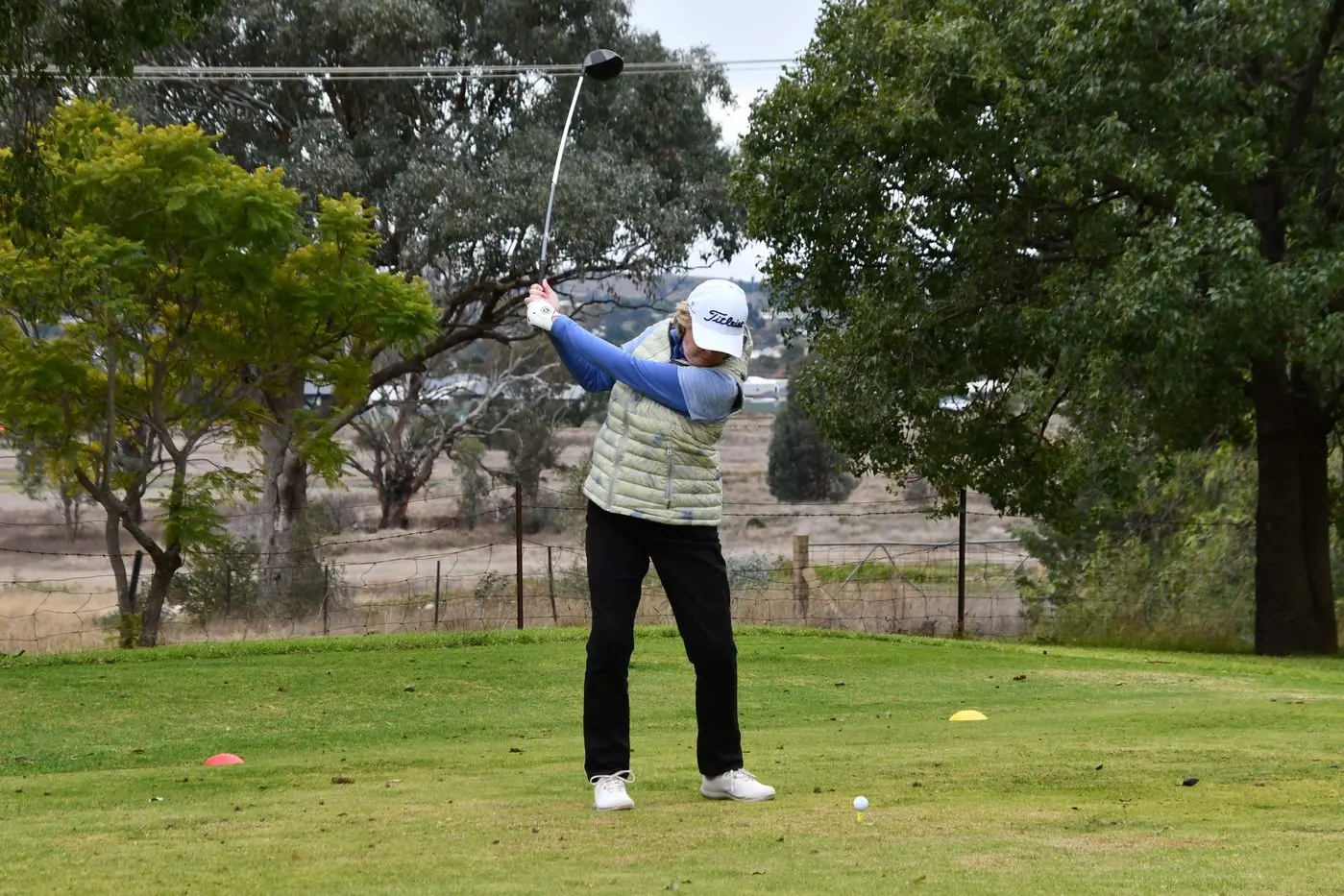 The weather played havoc for the August Monthly Medal with only 61 players teeing off. Pictured is Anita Medcalf who tees off in cold conditions on the Parkes golf course. PHOTO: Jenny Kingham