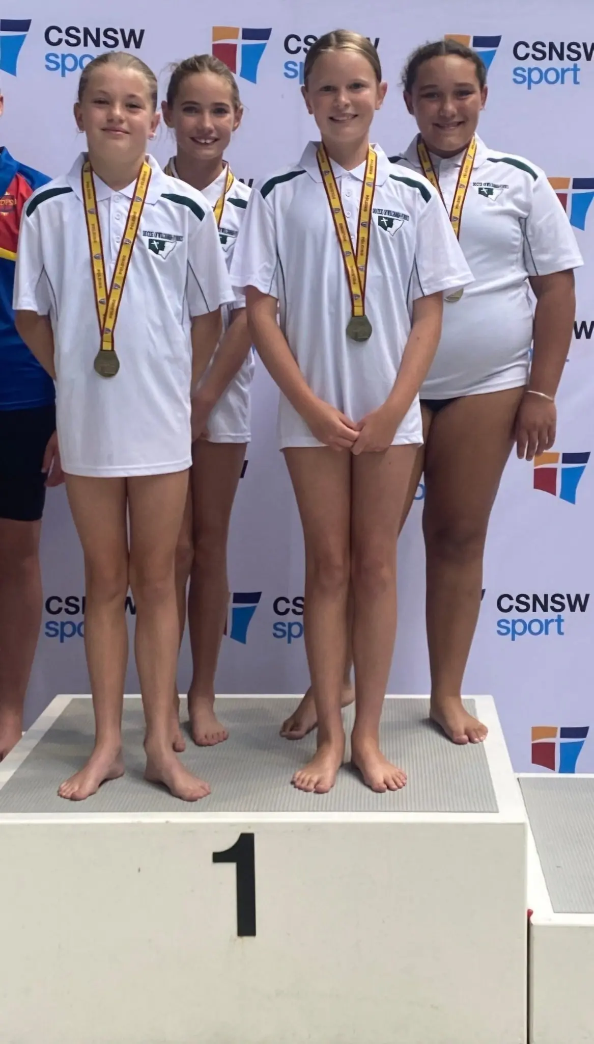Tilly Holloway, Alexis Gaut, Abby Quade and Peyton Stevenson with their gold medals on the podium in Sydney. PHOTO: Supplied