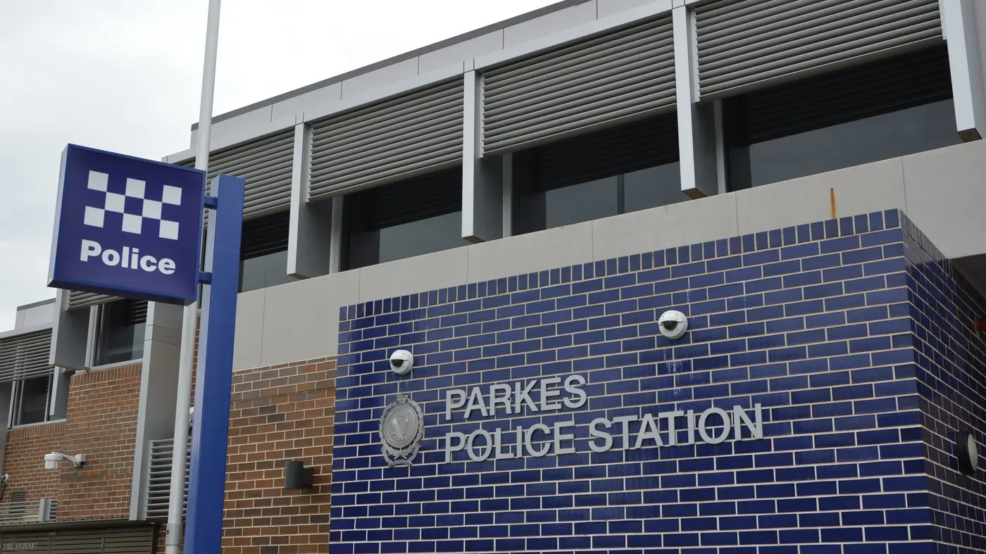 Man charged over carrying flag with offensive symbol