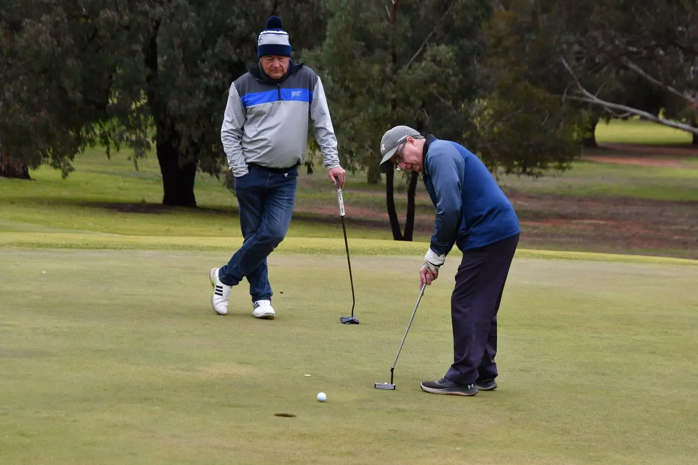 The Parkes Golf Course saw 41 teams for a two Person Ambrose on Saturday. Pictured is Dave Brown who watches Wayne Powter putt. PHOTO: Jenny Kingham