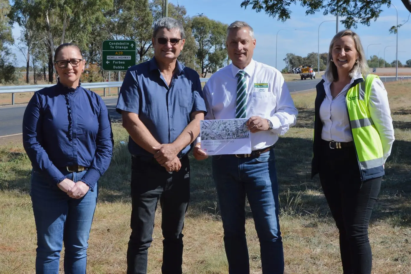 Deputy Mayor Marg Applebee, Parkes Shire Mayor Neil Westcott, candidate Jamie Chaffey and Parkes Shire Council Acting Director of Operations Marisa Malherbe with the Parkes Western Entry Master Plan.