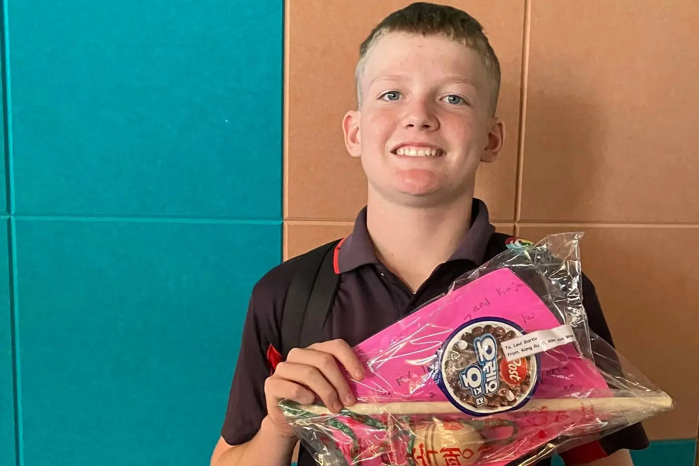 Levi Bartle received his gift from his new South Korean friend. PHOTOS: Supplied