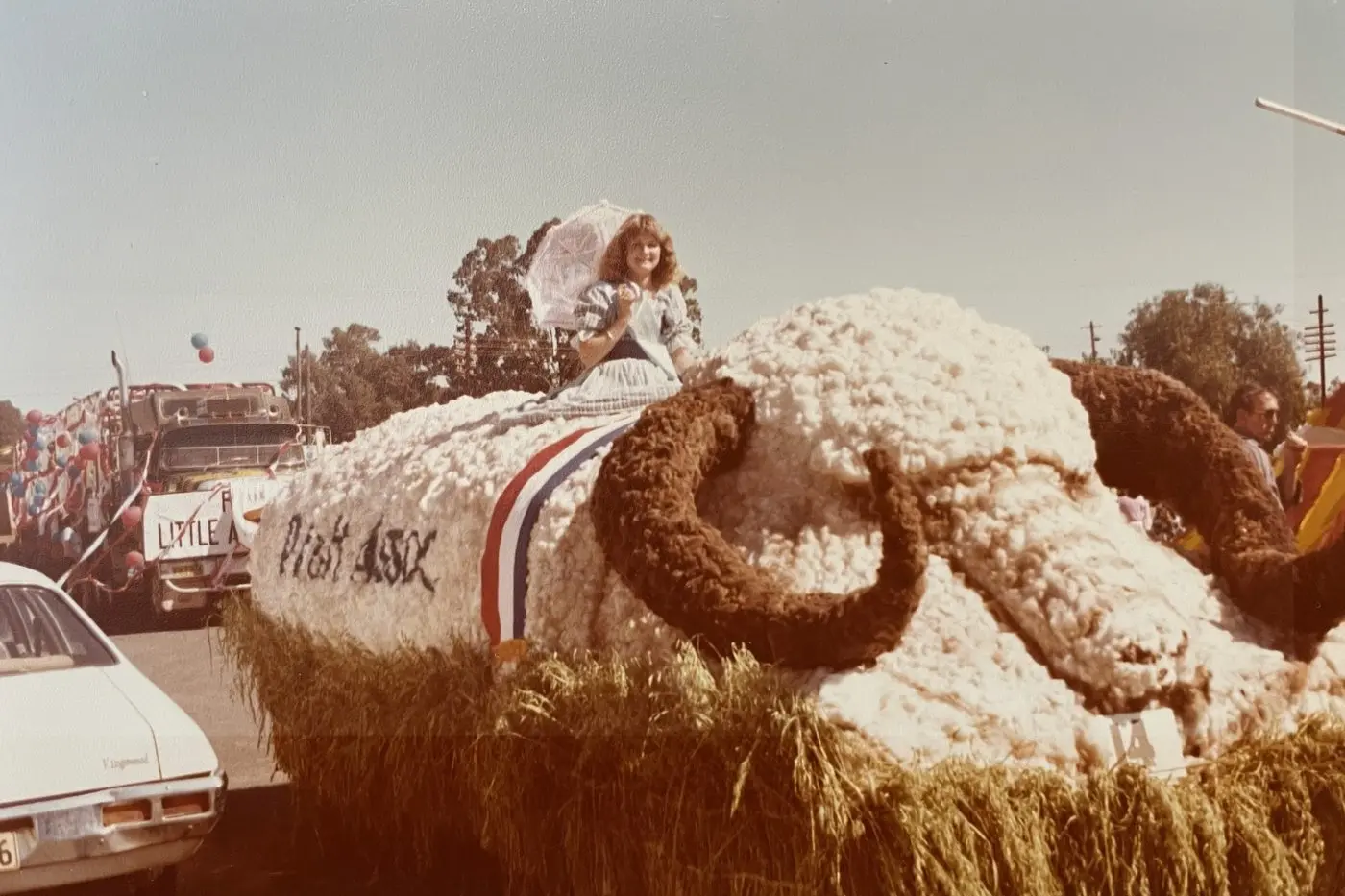 The Parkes Agricultural and Horticultural Association float and its participants. The name of this woman is unknown.
