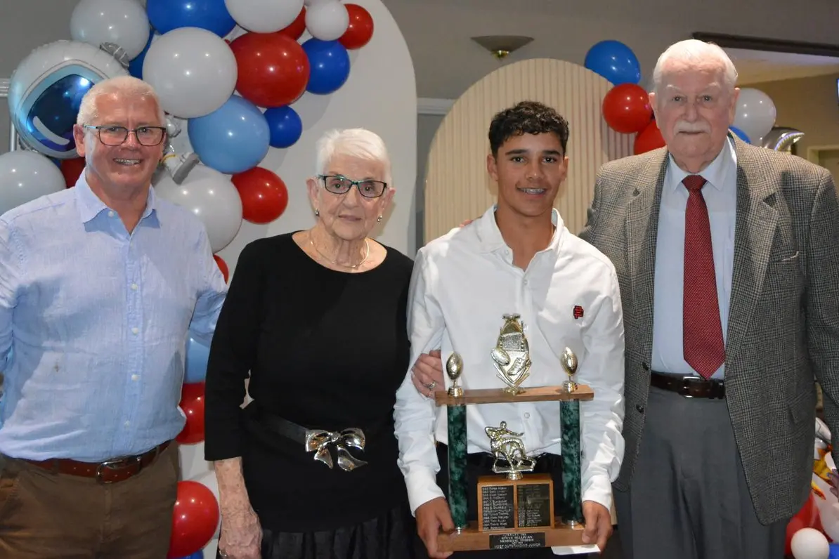 Parkes Spacemen president Tony Dwyer, and Brenda and John Sullivan present Taj Lovett the Steve Sullivan Memorial Award for Most Outstanding Junior.