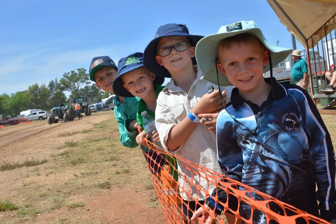 Parkes boys Archie Curtis (9), Brock (6) and Lucas (8) Morrison and Lachie Hutchings (6) were front and centre to watch the tractor pull on Saturday. PHOTOS: Christine Little