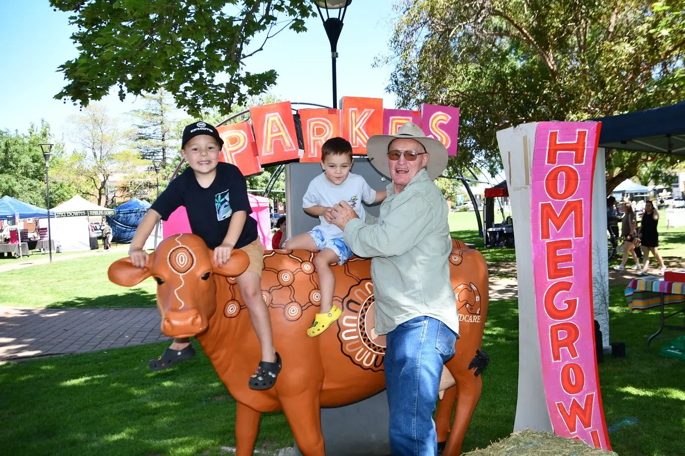 Sonny and Jimmy Lock with their Grandfather John Stevenson with the Central West Lachlan Landcare\\'s cow \\'Geraldine\\'. PHOTOS: Jenny Kingham