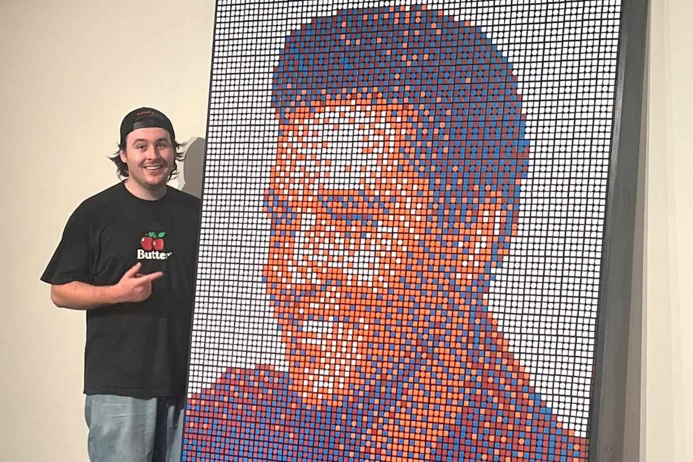 Former Parkes boy Angus Hannelly is the novice artist behind the portrait of Elvis made from cubes now on display during the Elvis Festival. PHOTO: Supplied