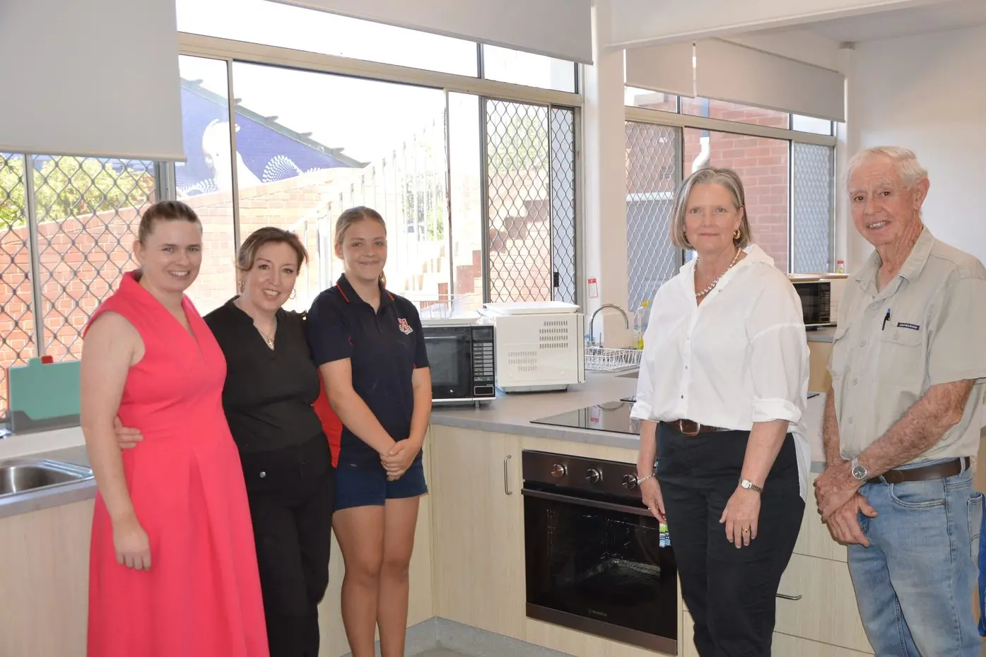 Laura Jackson, Kylie Jones, Abigail Downes, Jennifer Wickham and Terry Job check out one of the new kitchen bays