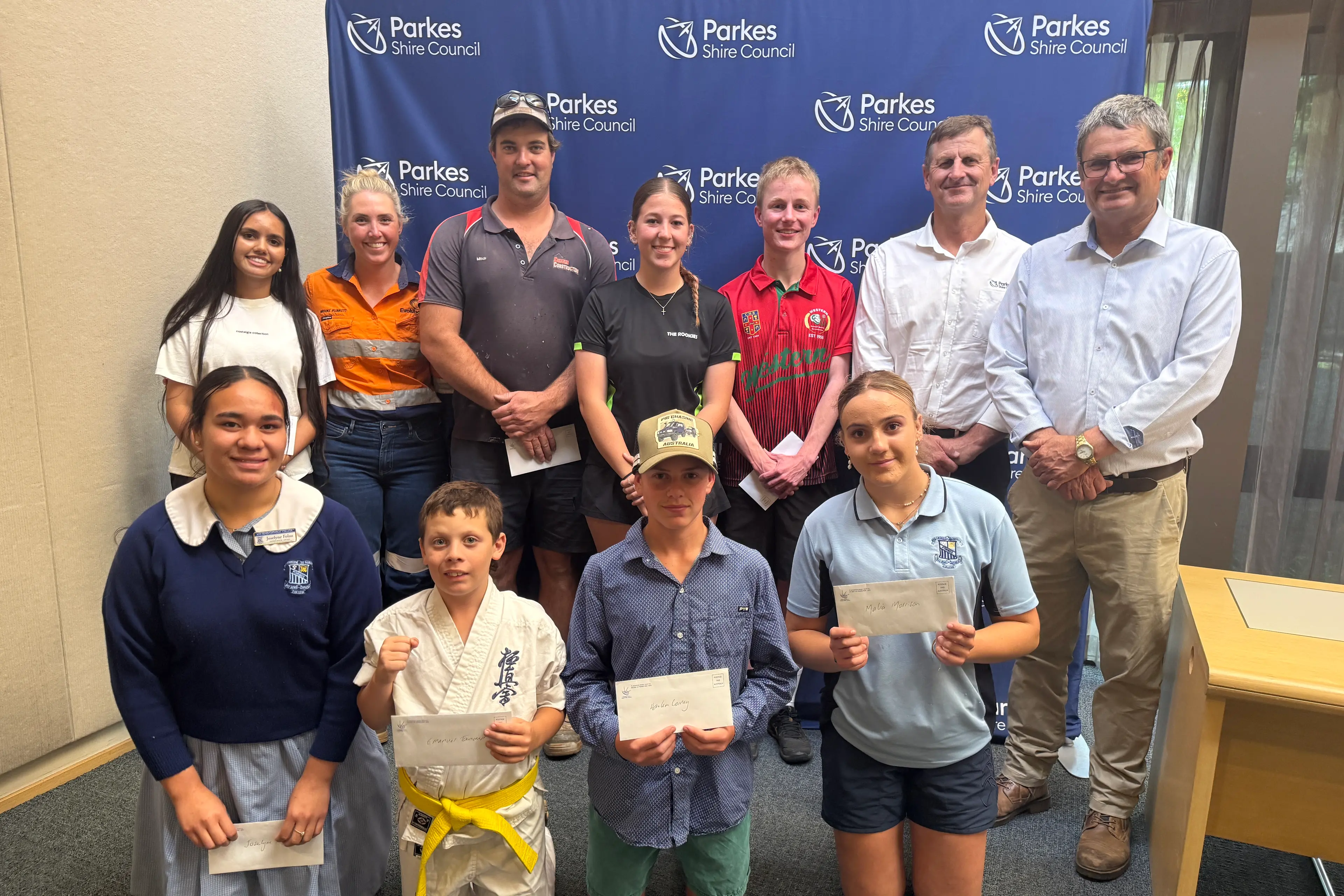 <p>Rising start and sporting organisation recipients with Brooke Plunkett (NPM) and Mayor Neil Westcott. Back: Sienna Eve Taylor, Brooke Plunkett,  Mitch Cudden, Ella McColl, Sam Rivett, Graeme Bayliss and Mayor Neil Westcott. Front: Joselyne Folau, Emanual Townsend, Harlen Corney and Malia Morrison. </p>\\n
