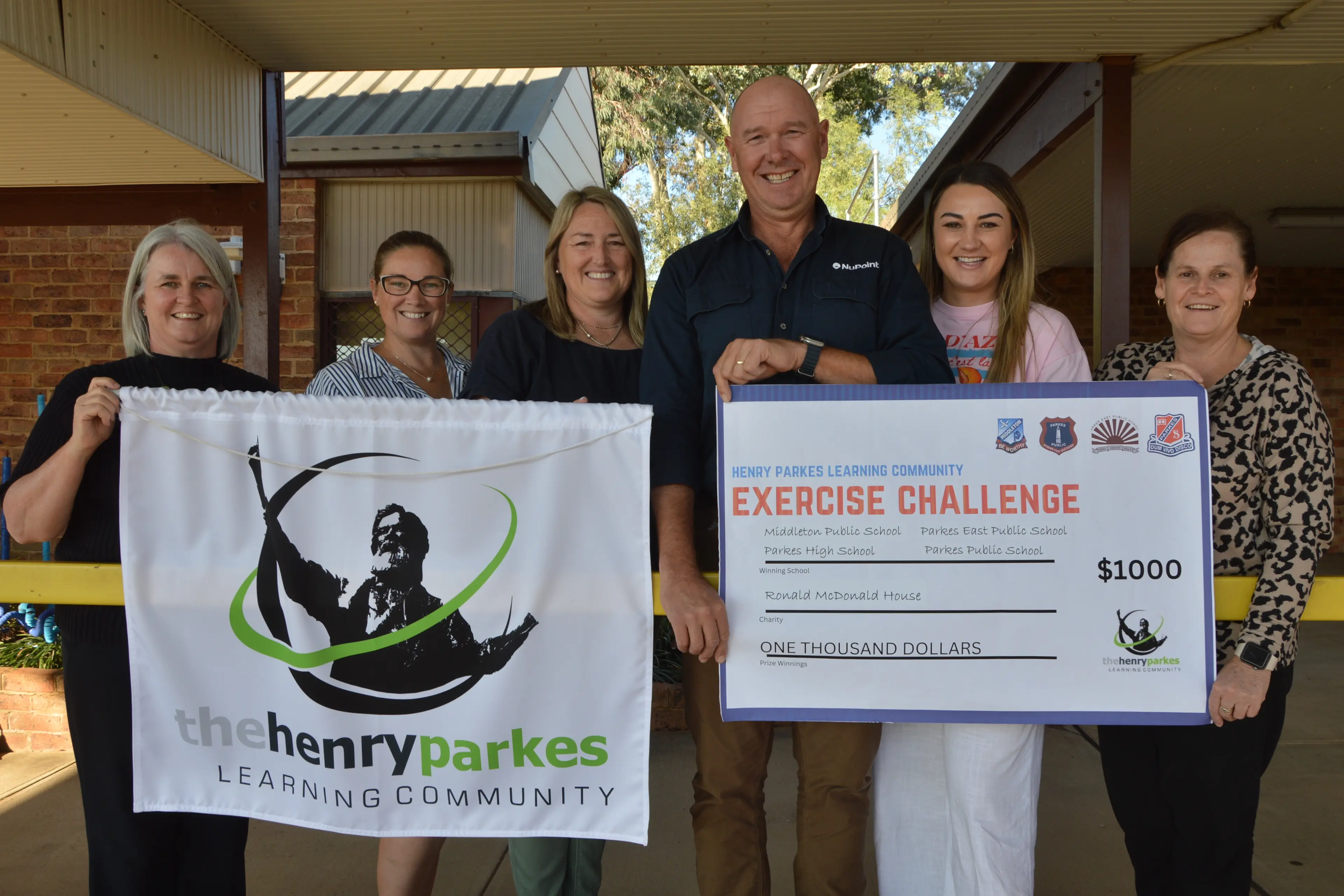 <p>Ronald McDonald House Orange board member Geoff Rice accepted the $1000 raised from the exercise challenge, from committee members Claire Mackenzie (Parkes East Public School), Jane Howard (Parkes Public School), Justine Morrissey (Parkes High School), Stacey Jones and Leanne Wright (both Middleton Public School). PHOTO: Christine Little</p>\\n