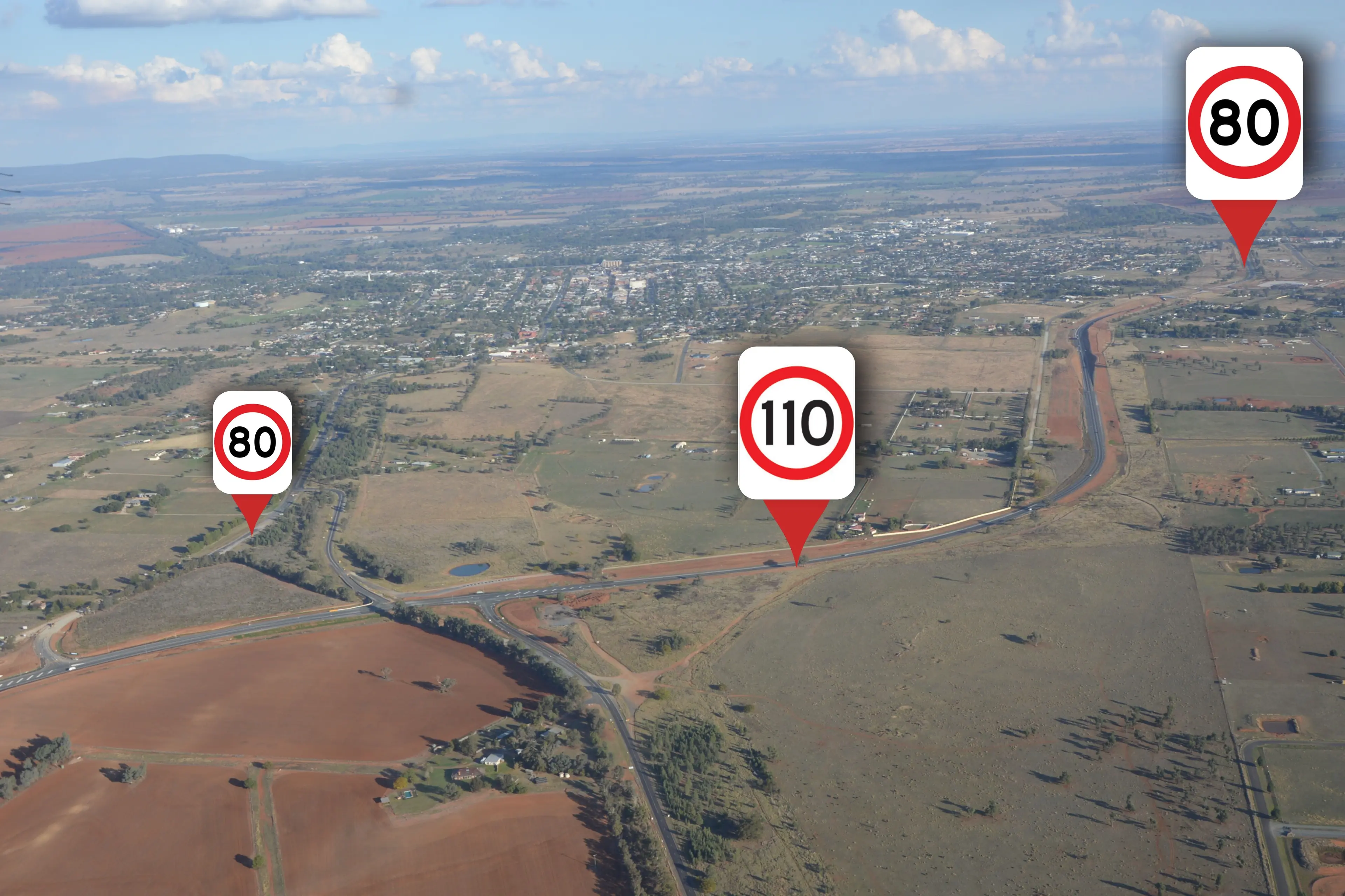 <p>This view, looking south, shows the northern end of the Parkes Bypass with the northern connection and Peak Hill Road on the left sign-posted 80km/h, the bypass in the north at 110km/h and the bypass near the roundabout at 80km/h (top right). PHOTO: Christine Little</p>\\n