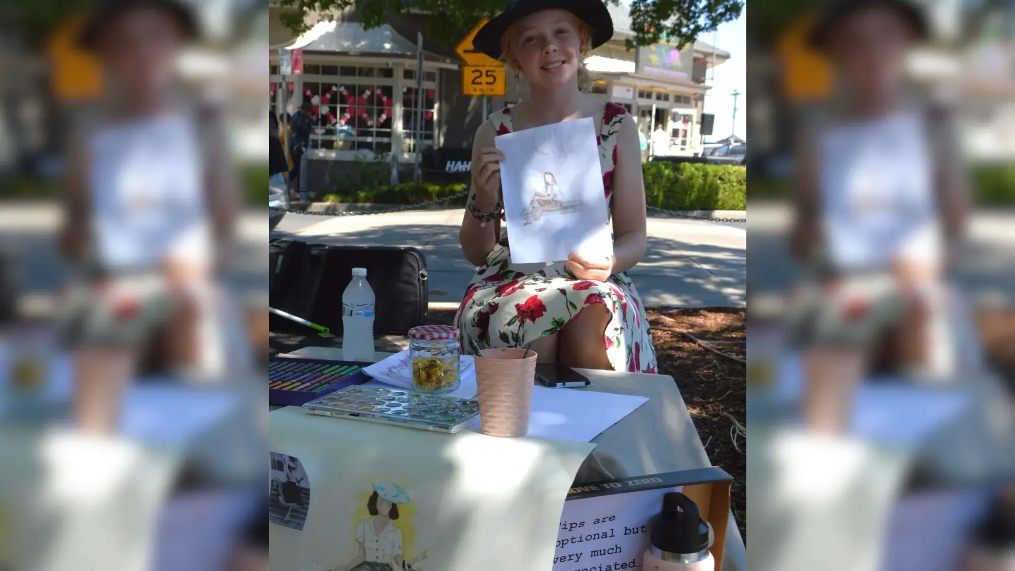 Grace's drawings bring joy to festival and give to charity