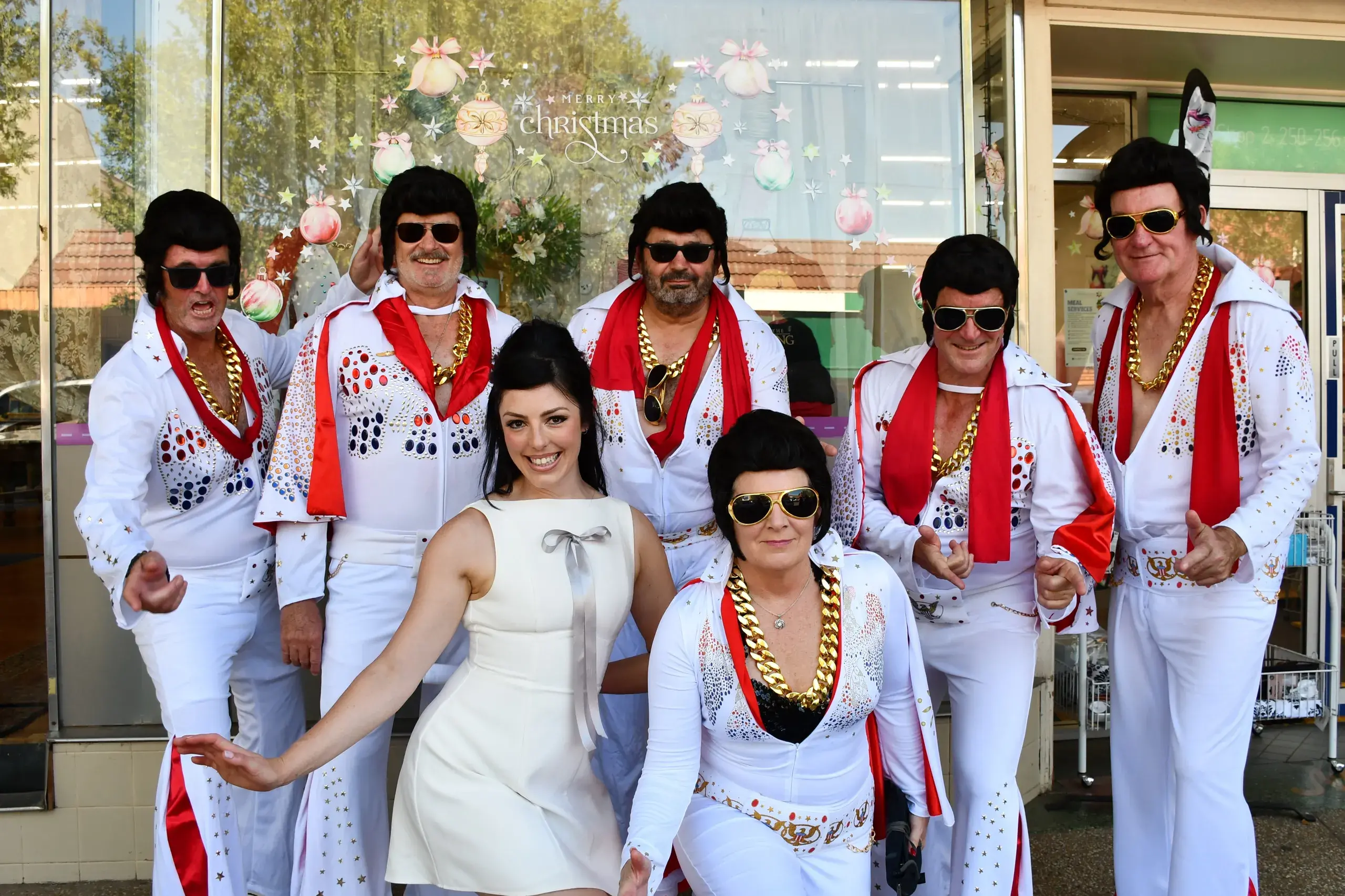 <p>Elvii with Priscilla on day two of the Parkes Elvis Festival. PHOTO: Jenny Kingham</p>\\n