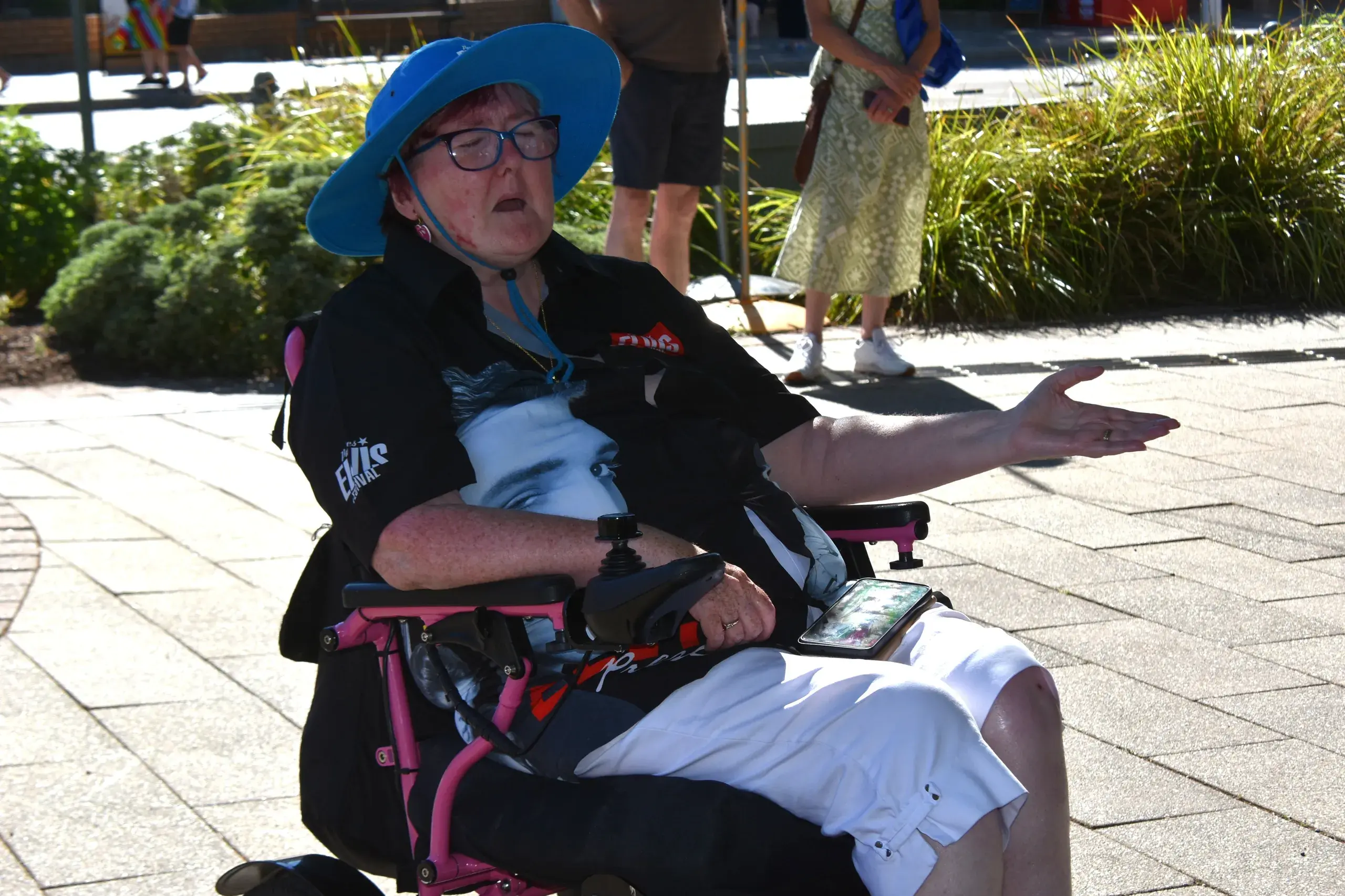 <p>Lorana Dowling from Tasmania lost in the words of Can\\'t Help Falling in Love that was being performed in the street. PHOTO: Christine Little</p>\\n