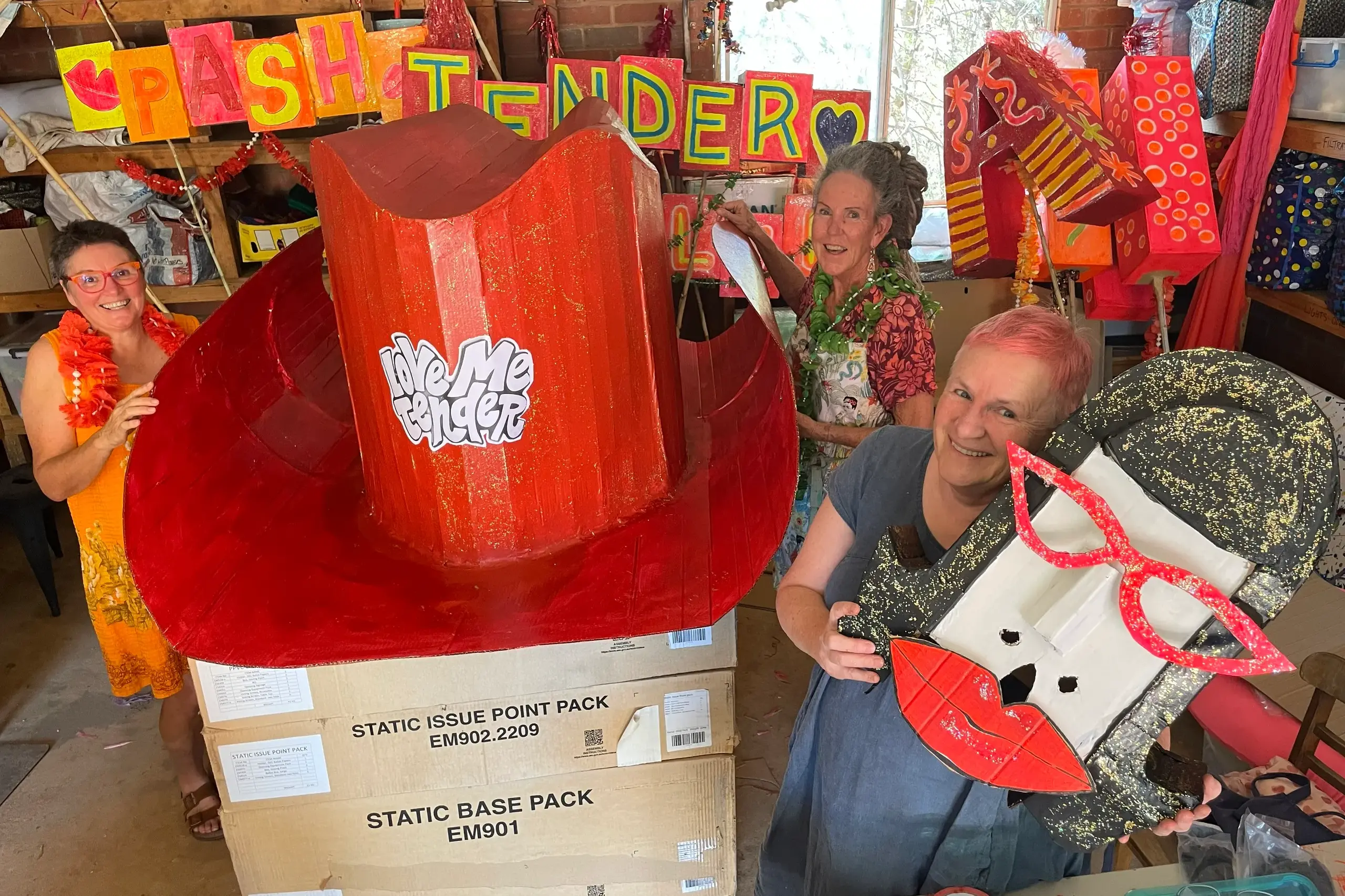 <p>Parkes artists Helen Standen, Jo Laurie and Margot Jolly, along with a few others, have been working solidly this last week on the Elvis Festival street parade float. PHOTO: Christine Little</p>\\n