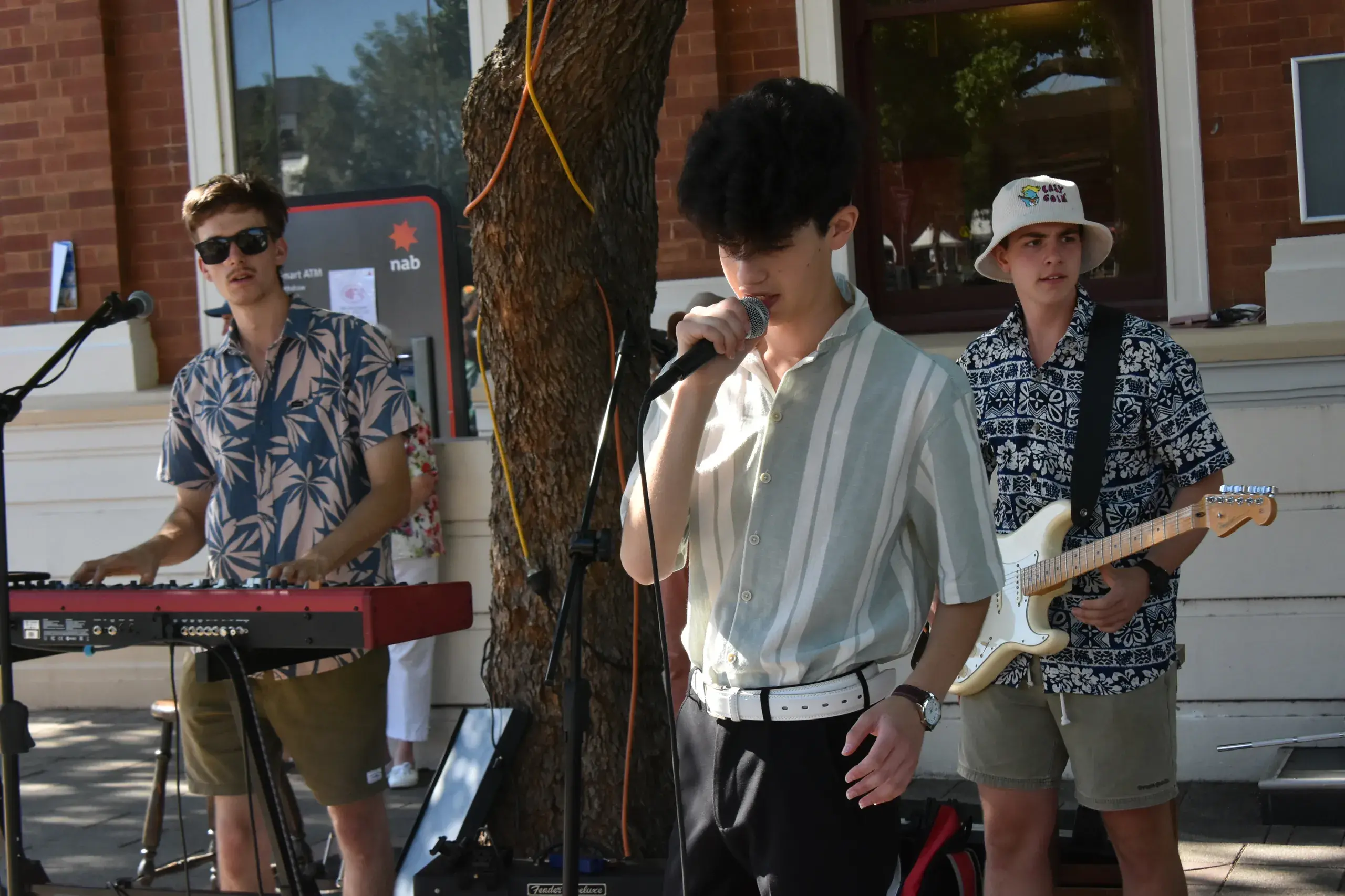 <p>17-year-old Ruben Aguilera from Wollongong busking with Easy Goin\\' from Parkes - Joey Tanswell (left) and Will Bligh at this year\\'s Parkes Elvis Festival. PHOTOS: Christine Little</p>\\n