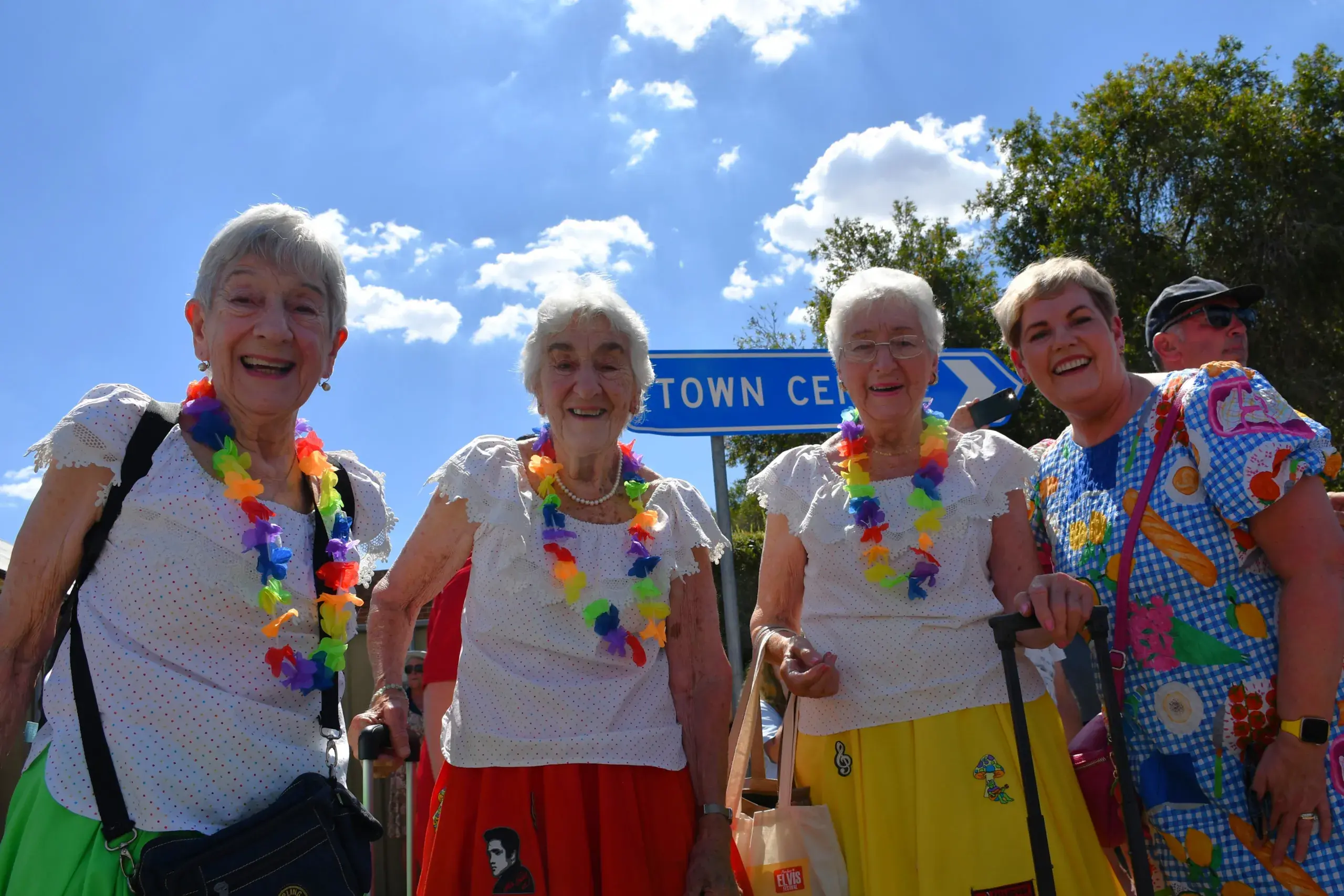<p>Sisters 85-year-old Ailsa Grant, 88-year-old Gail Pickles and 87-year-old Dawn Dunning ready to rock \\'n\\' roll at another Parkes Elvis Festival, their home hostess Jen Harris collecting them after riding the Elvis Express. PHOTO: Jenny Kingham</p>\\n