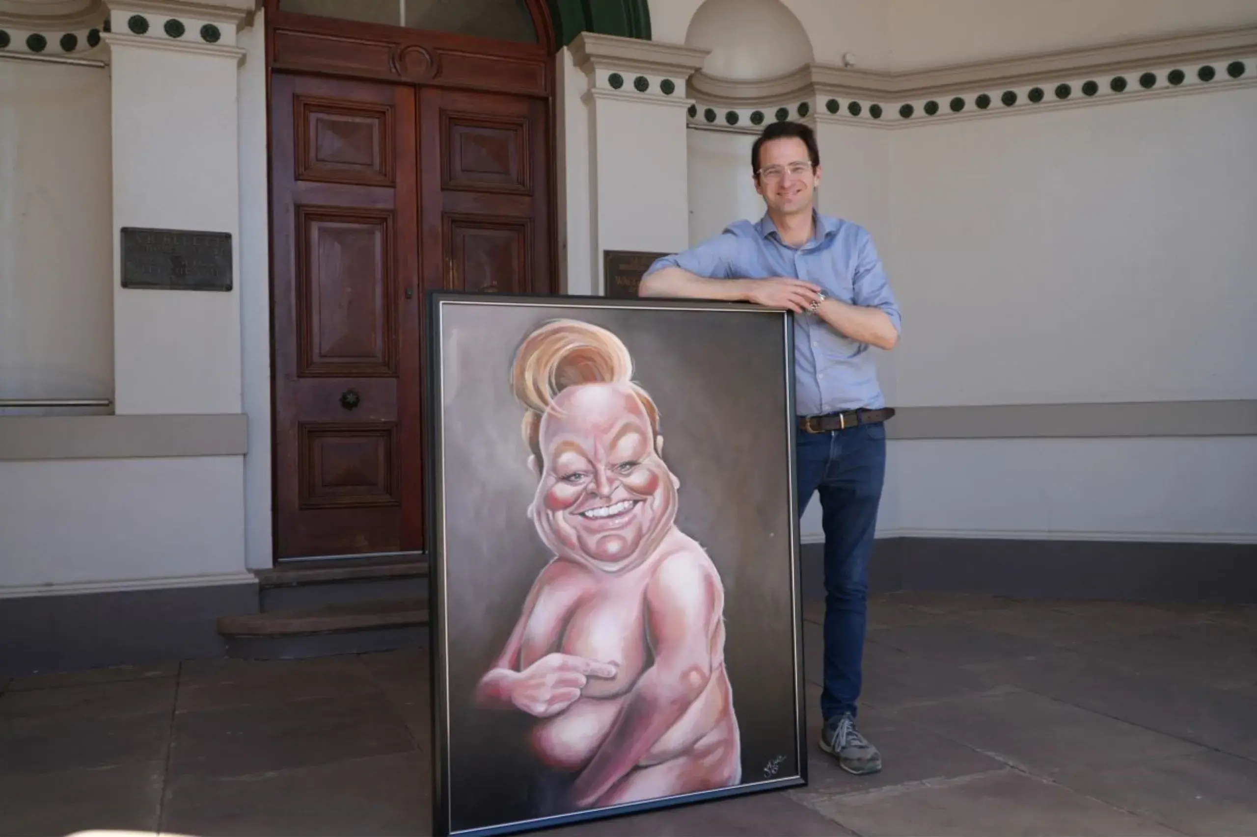 <p>Manager Museum of the Riverina Tim Kurylowicz with 2010 Bald Archy Prize winner Patti\\u2019s Cake by Judy Nadin.</p>\\n