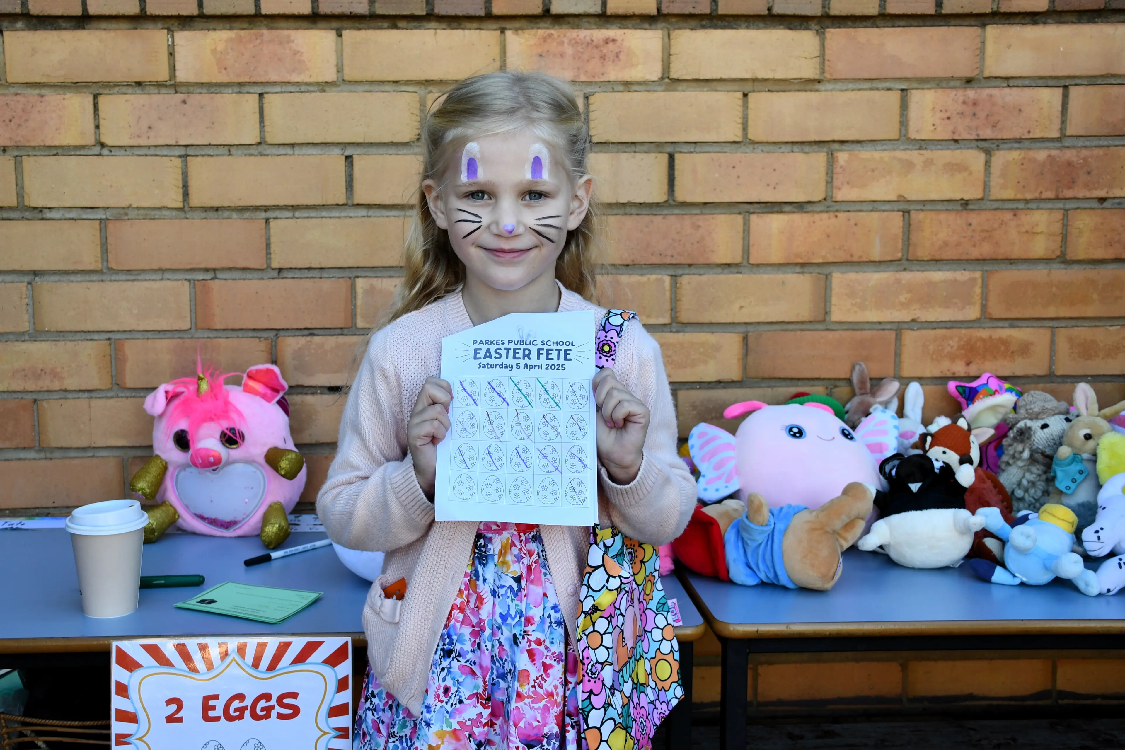 <p>Elly Lewis collected eggs to win a prize at last year\\'s Parkes Public School Easter Fete. PHOTO: Jenny Kingham</p>\\n
