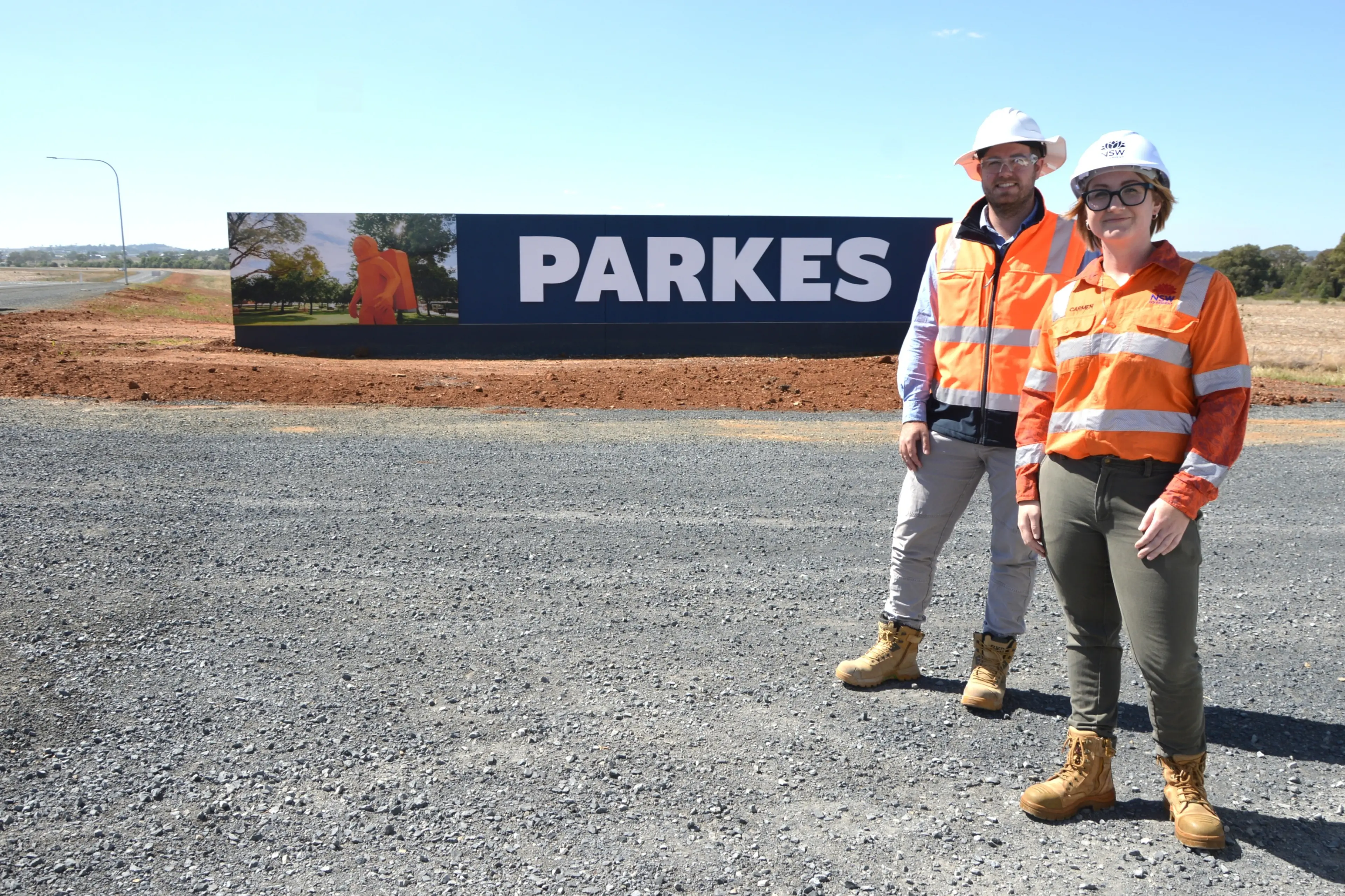 <p>Carmen Tom and James Beuzeville are former Parkes High School students who went on to work for Transport for NSW and eventually on one of the largest publicly-funded construction projects in western NSW, the Parkes Bypass. PHOTO: Christine Little</p>\\n
