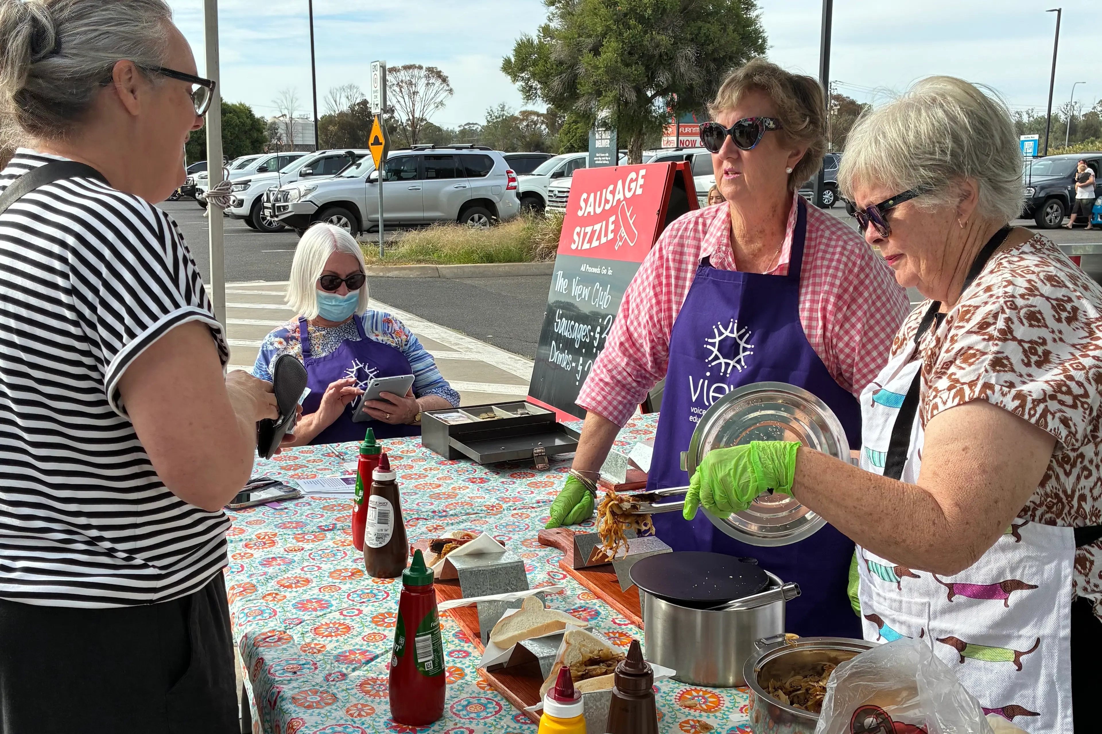 <p>View Volunteers Sue Pietsch, Heather Mackinnon and Carol Whatling manning the Bunnings BBQ fundraiser.</p>\\n