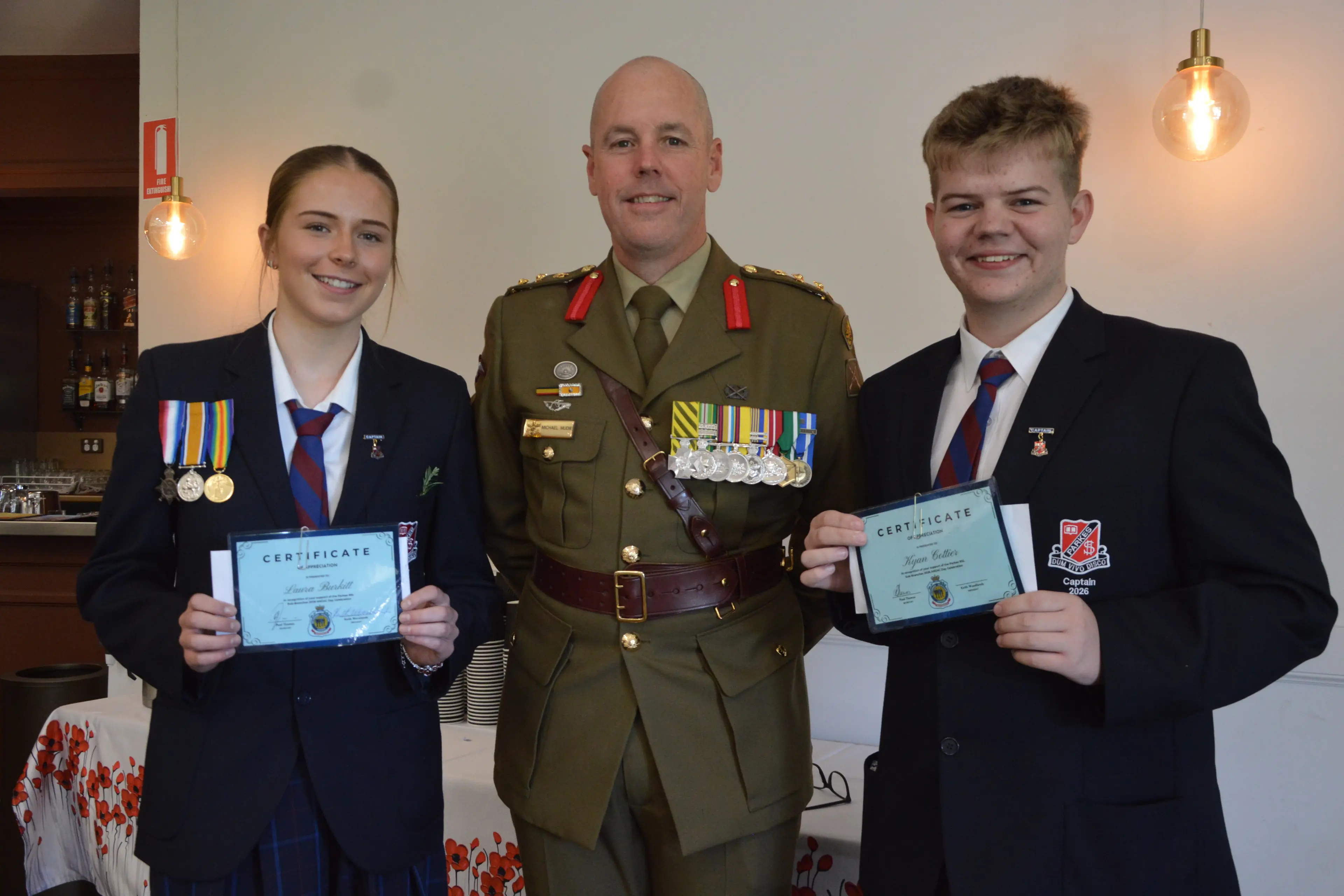 <p>Parkes High School captains Laura Burkitt and Kyan Cottier were presented their certificates from guest speaker Colonel Michael Mudie, who\\'s originally from Parkes. PHOTOS: Christine Little</p>\\n