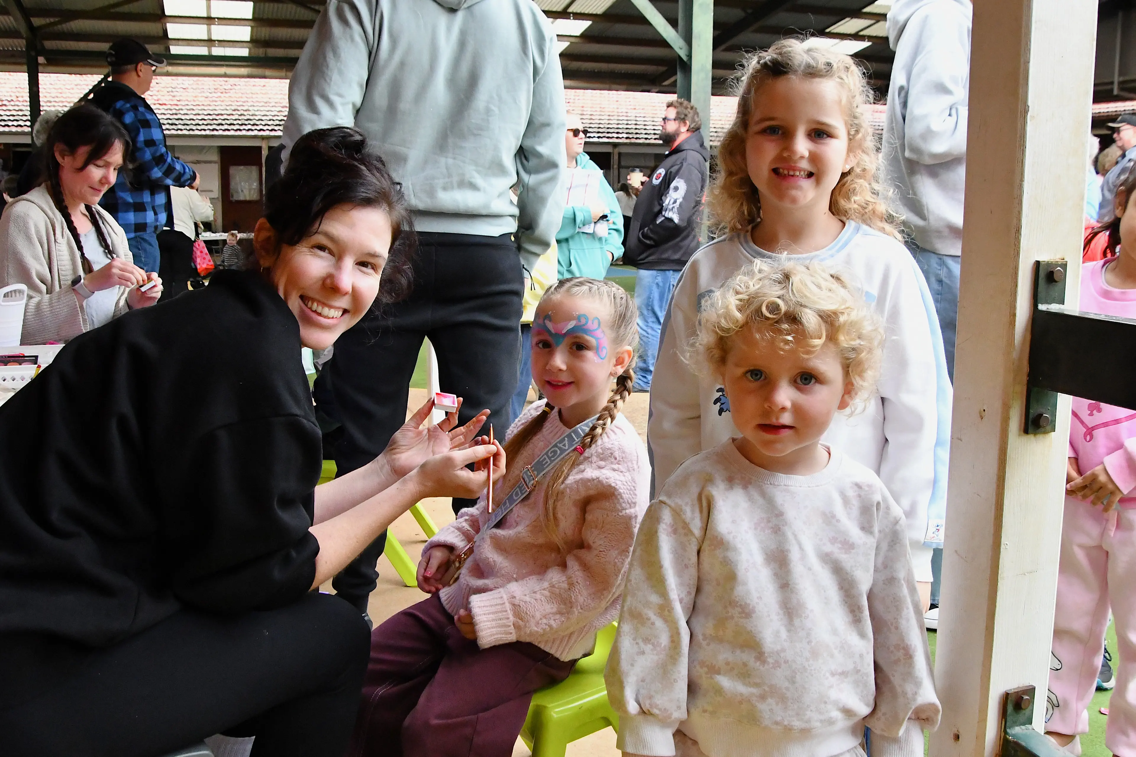 <p>Rosie Bennett painted Riley Prout\\u2019s face at the Parkes East Public School fete, who were watched by Estella and Sophie Thompson. PHOTOS: Jenny Kingham</p>\\n