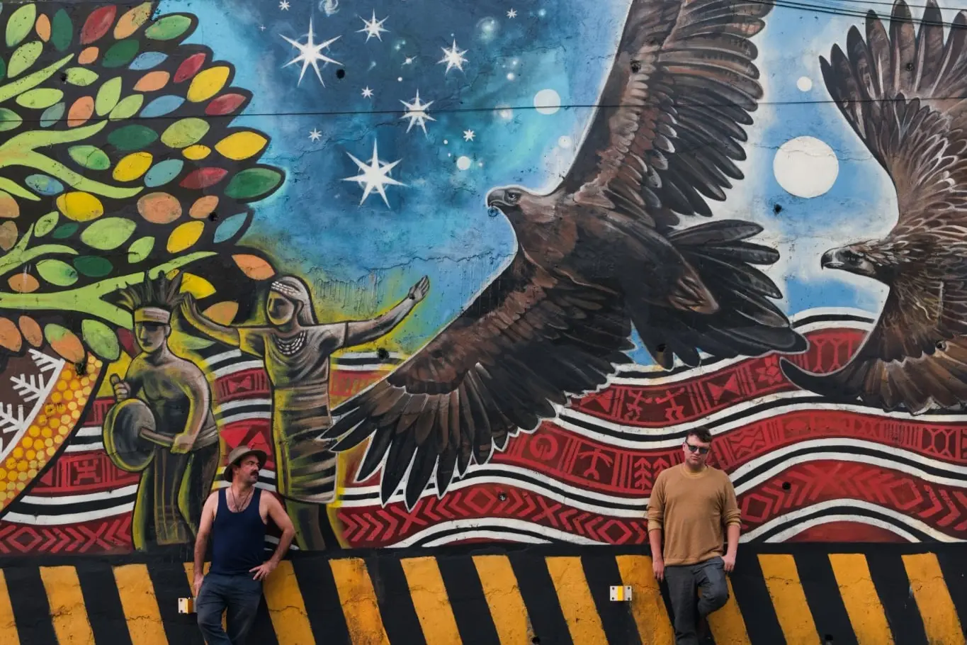 <p>Toby Finlayson and Sean James Cassidy stand in front of the mural Yindyamarra - a Wiradjuri word meaning \\u201Cdeep respect\\u201D - in Baguio Northern Philippines, a UNESCO Creative City. The mural was named in recognition of the cultural exchange and ongoing support the region has received from Central West creatives such as Finlayson and Cassidy.</p>\\n