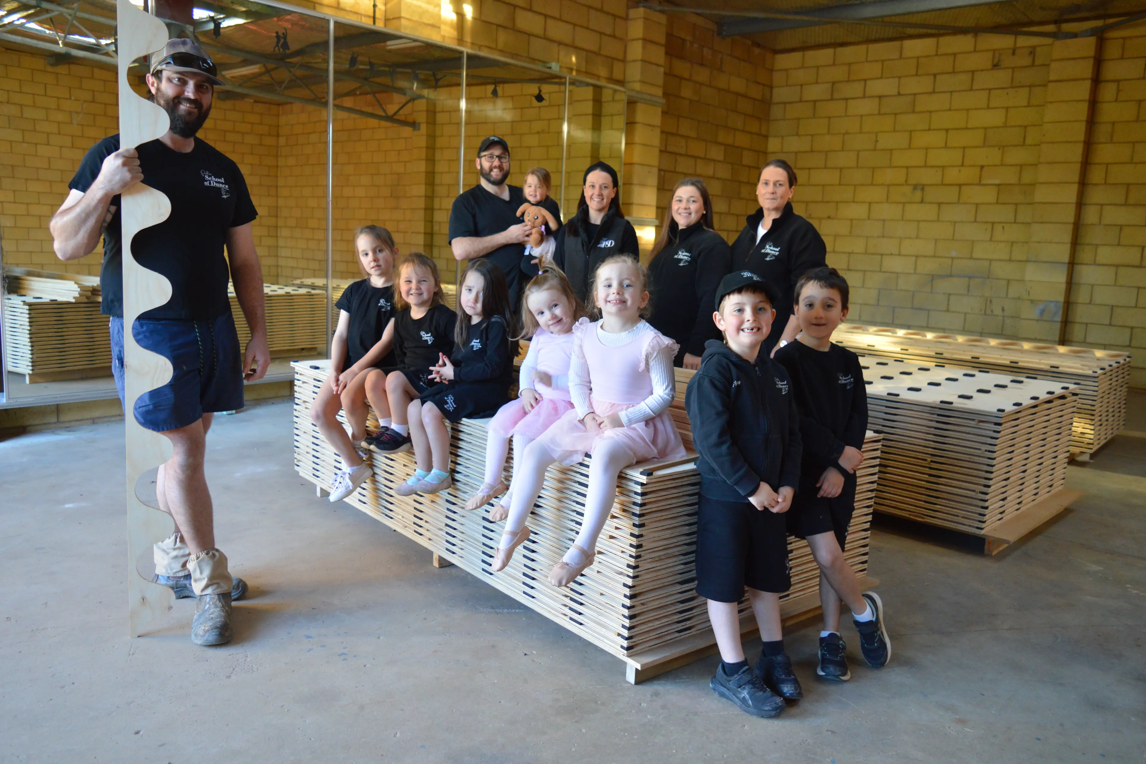 <p>Volunteers Jacob Paton (left) and Pat Williams (back) with Parkes School of Dance secretary Natalie Williams, treasurer Megan Coultas and vice president Julie Hutchison and junior dancers, were excited to see the installation of the new sprung dance floor. PHOTOS: Christine Little</p>\\n