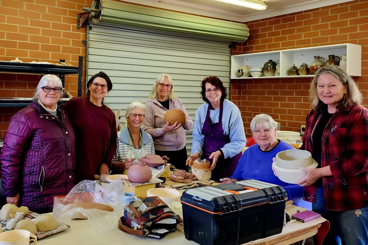 <p>Parkes Potters Group members Dianne Sondermeyer, Elizabeth Briton, Nola Reeves, Sue Maddison, Kath Forbes, Glenda Morgan and Robin Dean getting pieces ready for the exhibition.</p>\\n