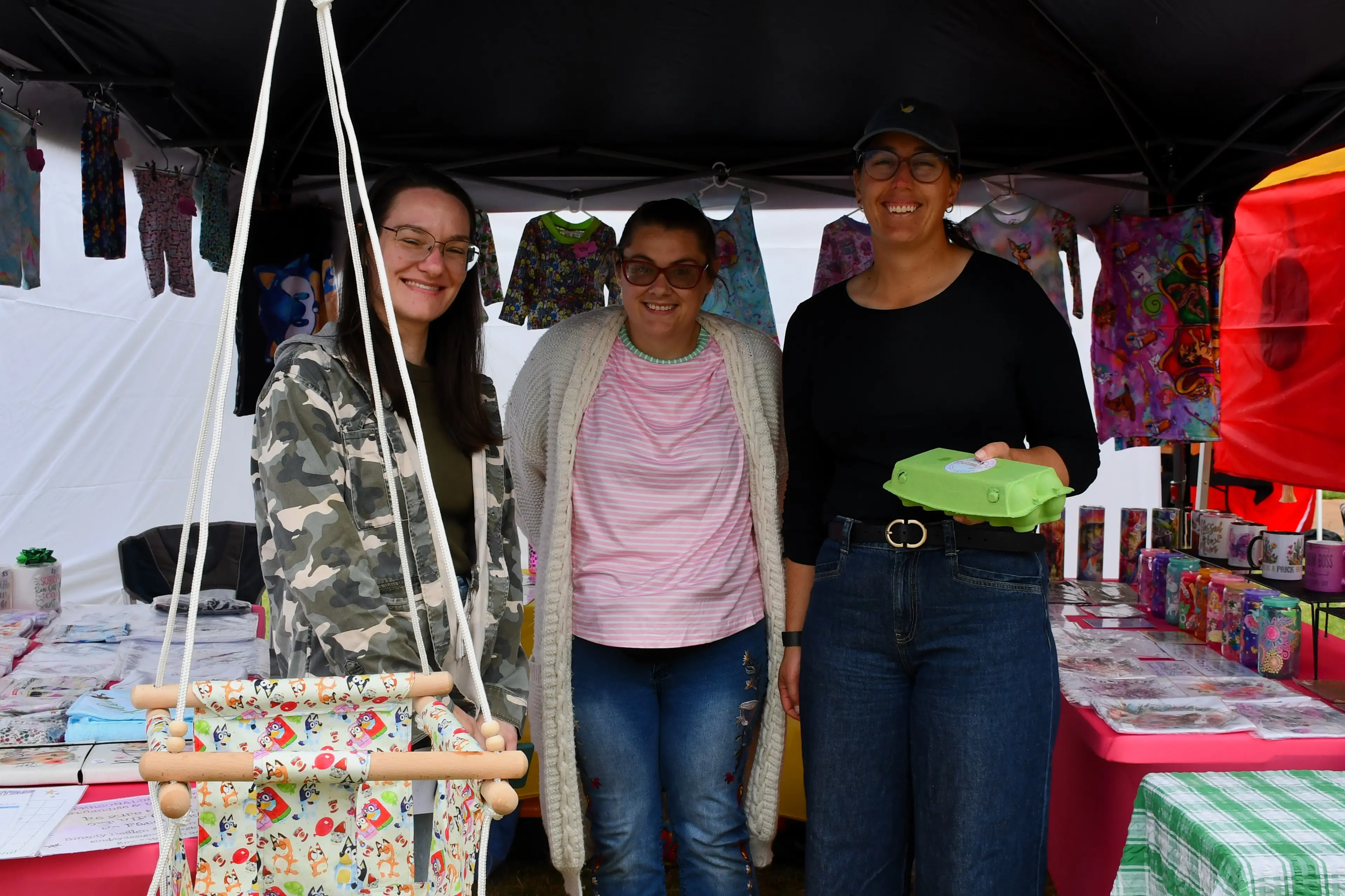 <p>Tessa Compton, stall holder Emi and Eliza Jagusiak at last year\\'s open gardens and markets at the Parkes Racecourse. PHOTO: Jenny Kingham</p>\\n