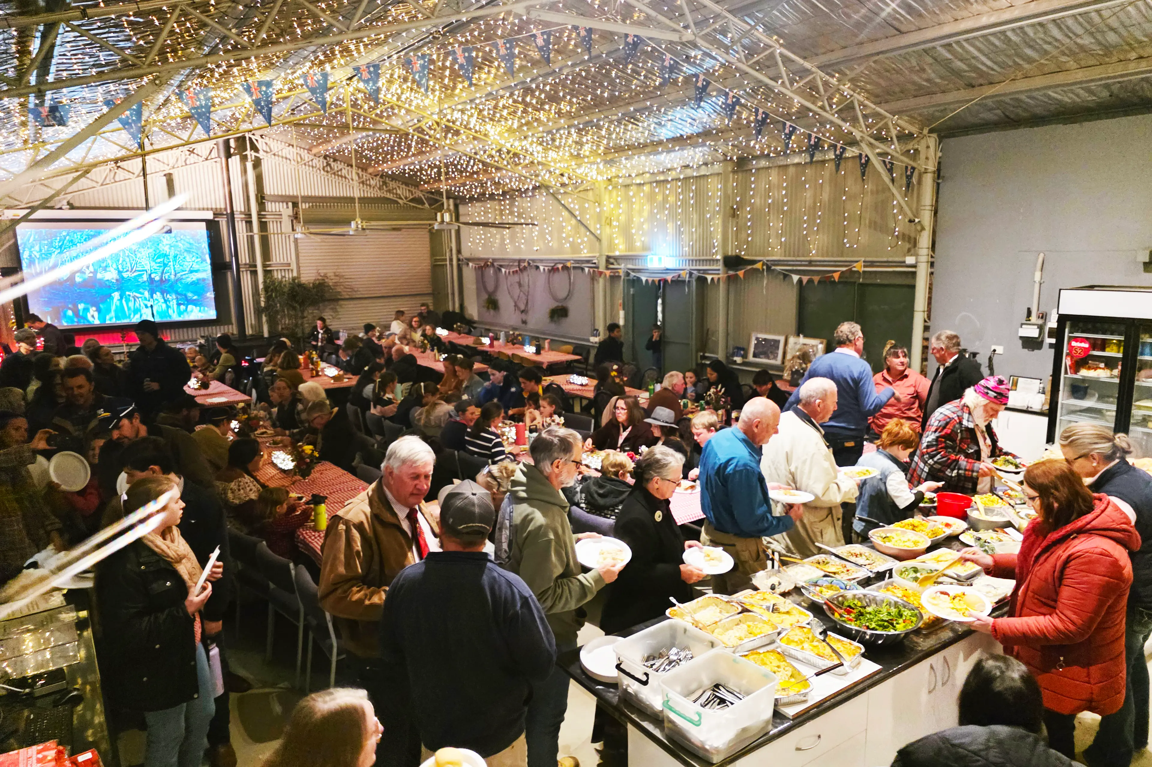 <p>In true country spirit, the community coming together for dinner at the Bush Dance and Poetry Night.</p>\\n