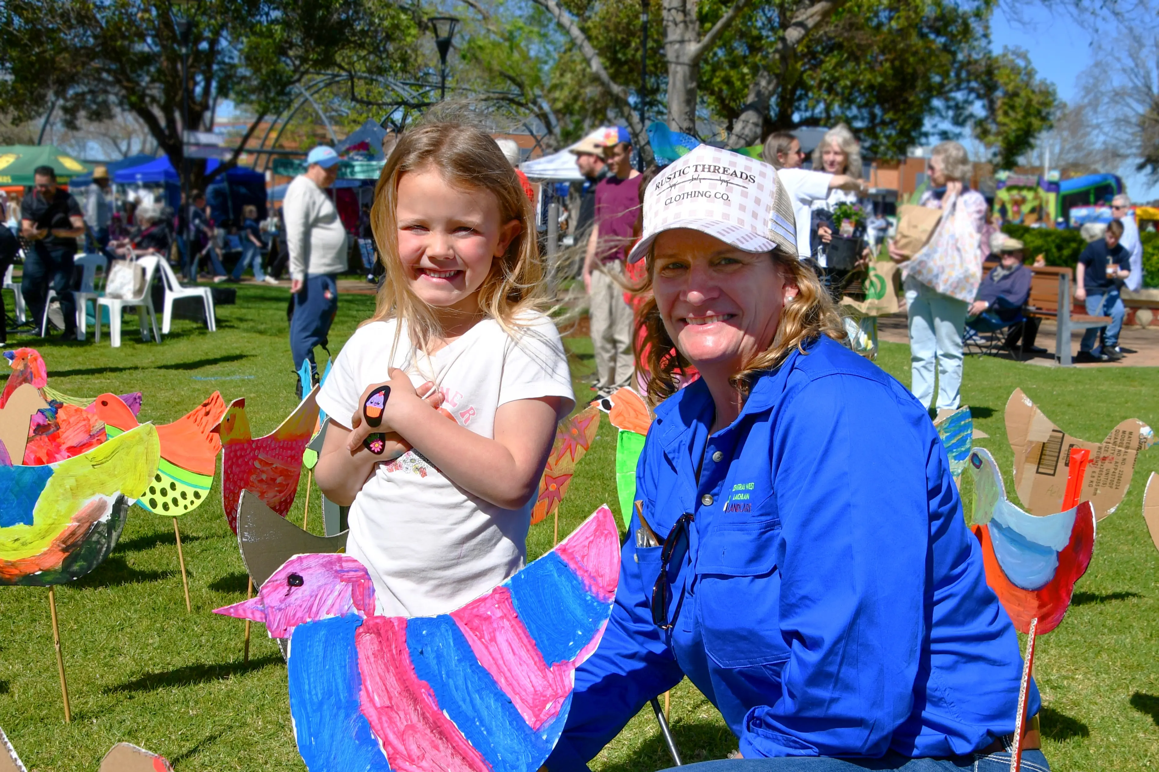 <p>The paint a chook kids activity was so popular they ran out of cardboard chooks - here is Piper Rudge with the new Lachlan Landcare coordinator Suzie Bunting. PHOTOS: Jenny Kingham</p>\\n