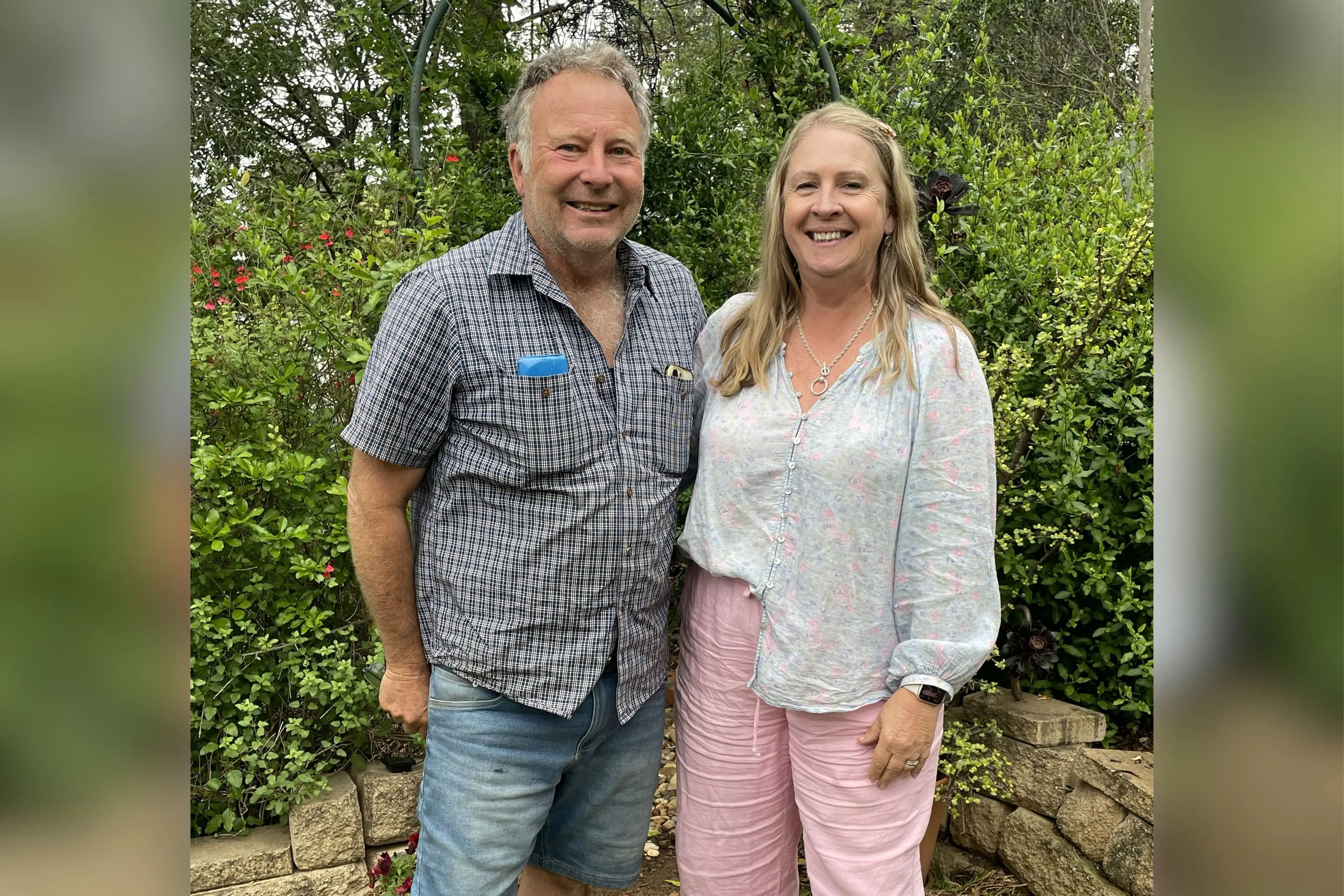 <p>Rodney and Jenny Barnes exploring a garden.</p>\\n
